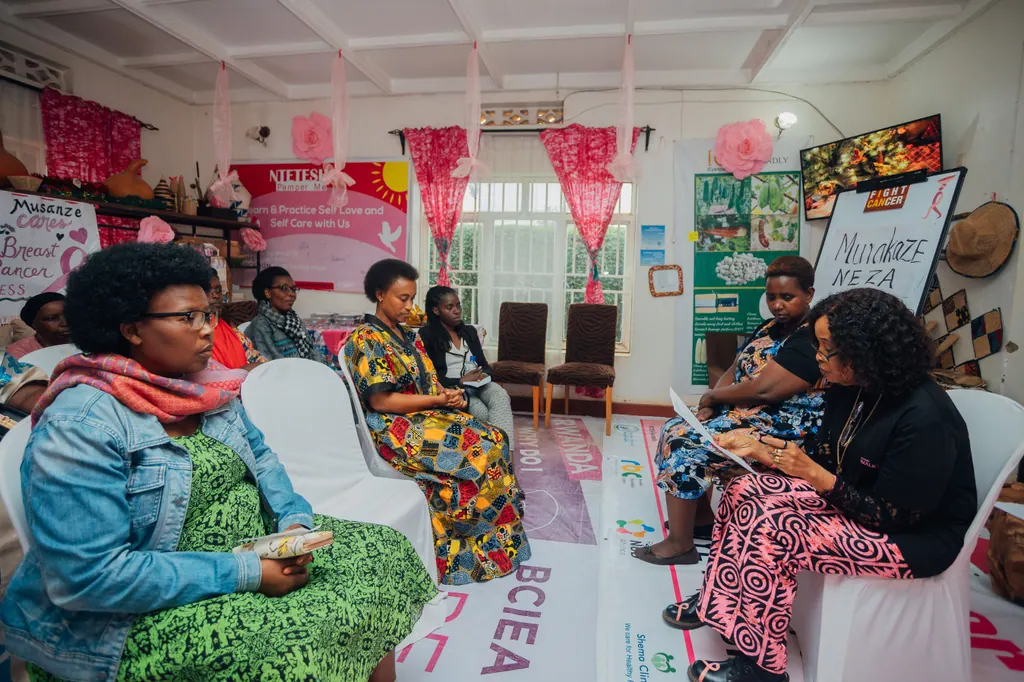 Women seated together in a workshop room with BCIEA signage on the wall.